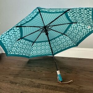 Teal COACH umbrella.